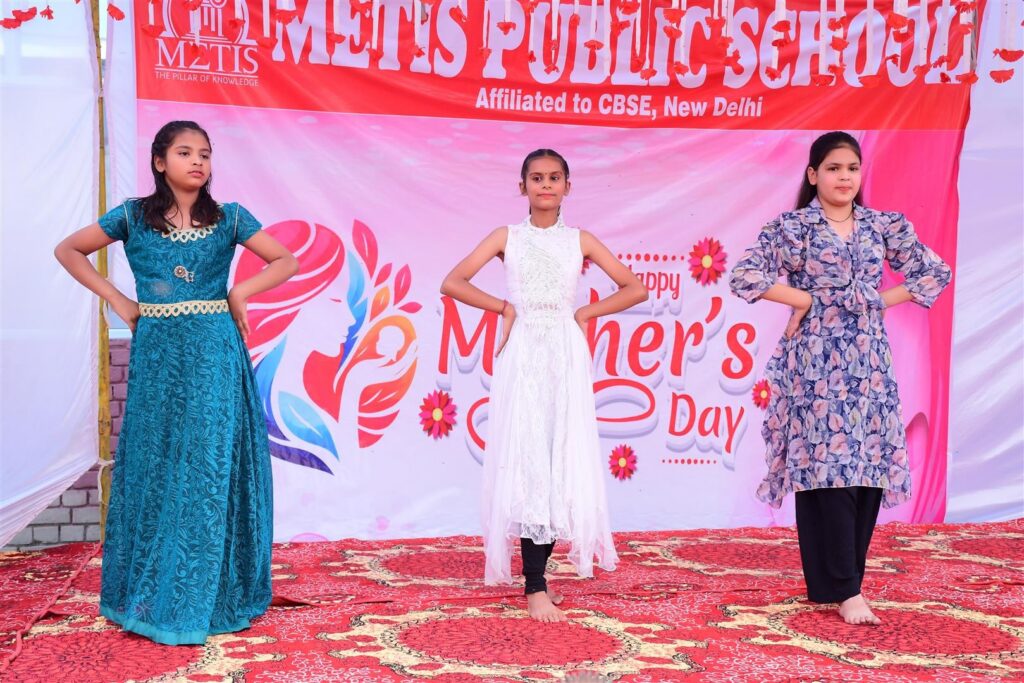 Students performing on stage on Mother’s Day 2026