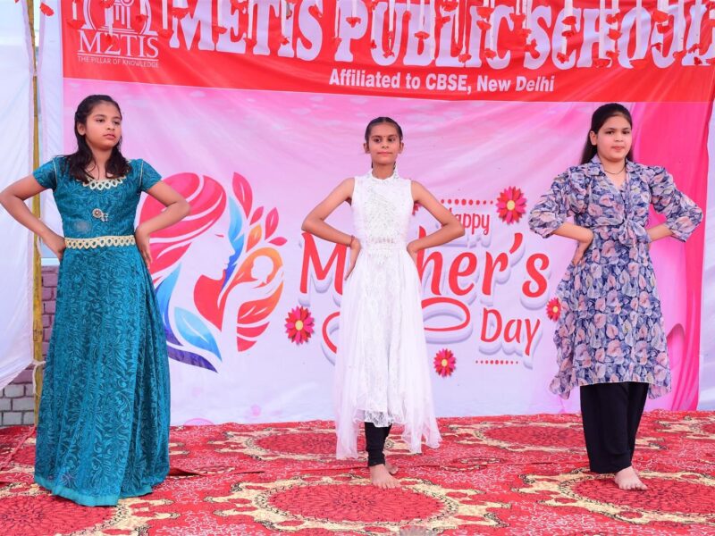 Students performing on stage on Mother’s Day 2026